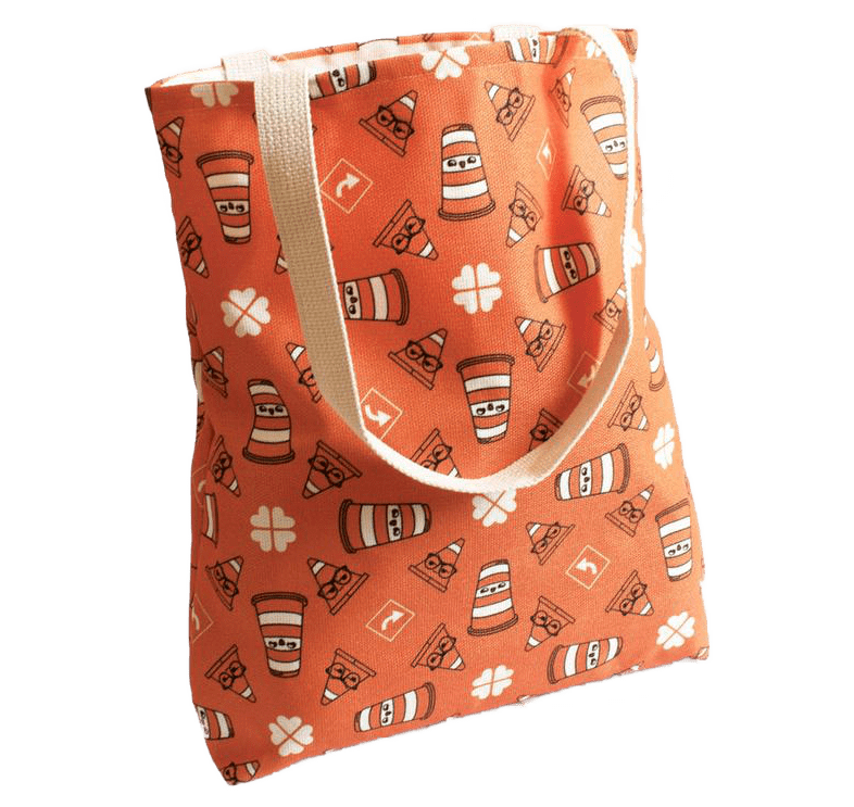 Un sac fourre-tout orange avec des dessins de Ponto